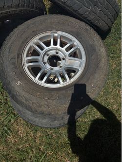 These are OEM 16-inch alloy wheels from a 2006-2010 Hummer H3.