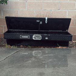 A Black Husky Aluminum Tool Box