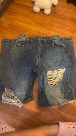 Woman’s ripped jeans