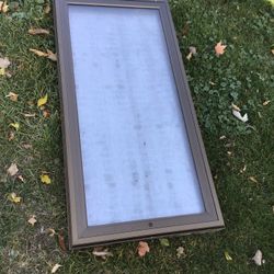 Display case. Metal with a glass top that opens.