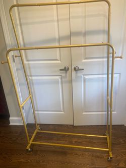Double Rack temporary garment / coat holder with 4 hooks and rolling wheels - perfect for party or for closet storage. Priced cheap to sell!