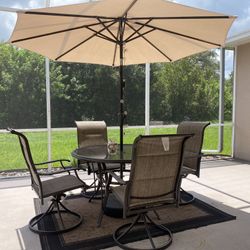 Patio Table , Chairs , And Umbrella 