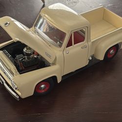This item is a 1:18 scale diecast model of a 1953 Ford F-100 pickup truck, likely manufactured by Road Legends