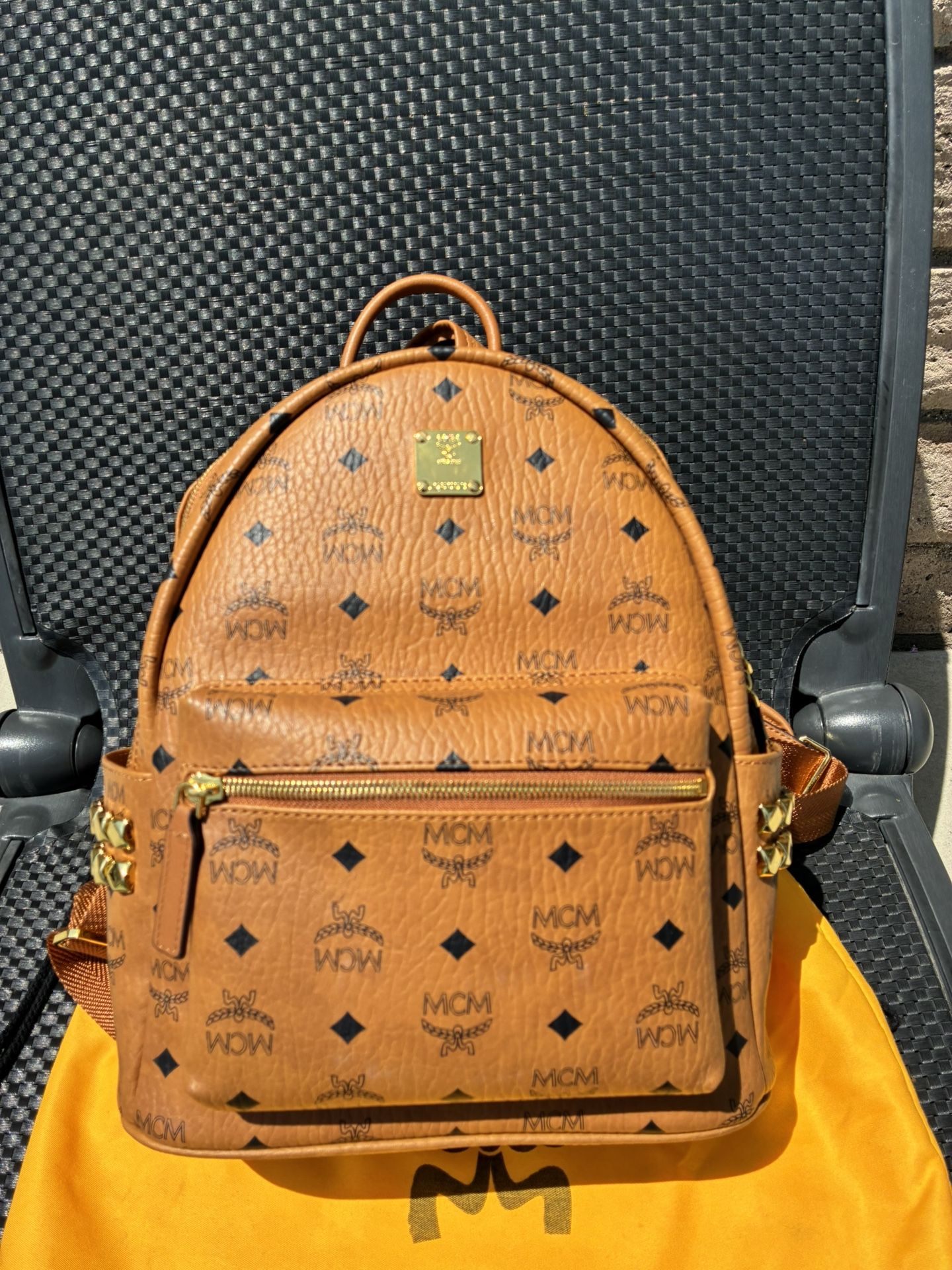 MCM Brown Backpack with Iconic Monogram and Metal Studs