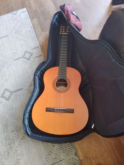 I fender guitar and case and tuning instruments and stuff