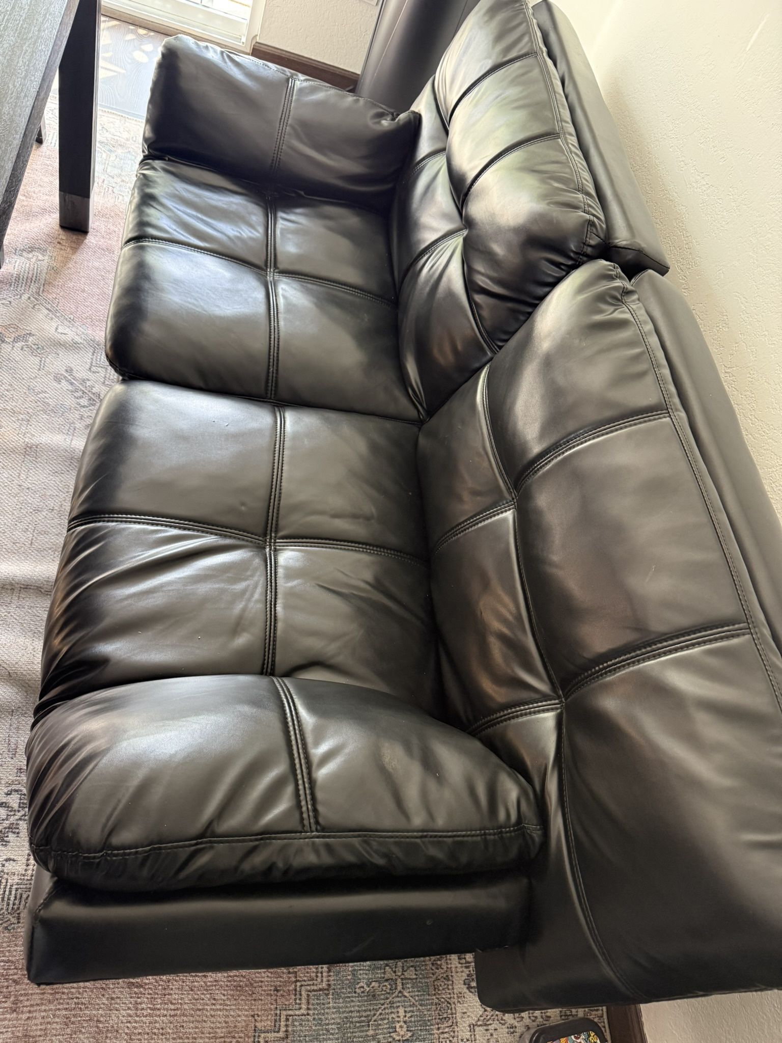 Black leather loveseat