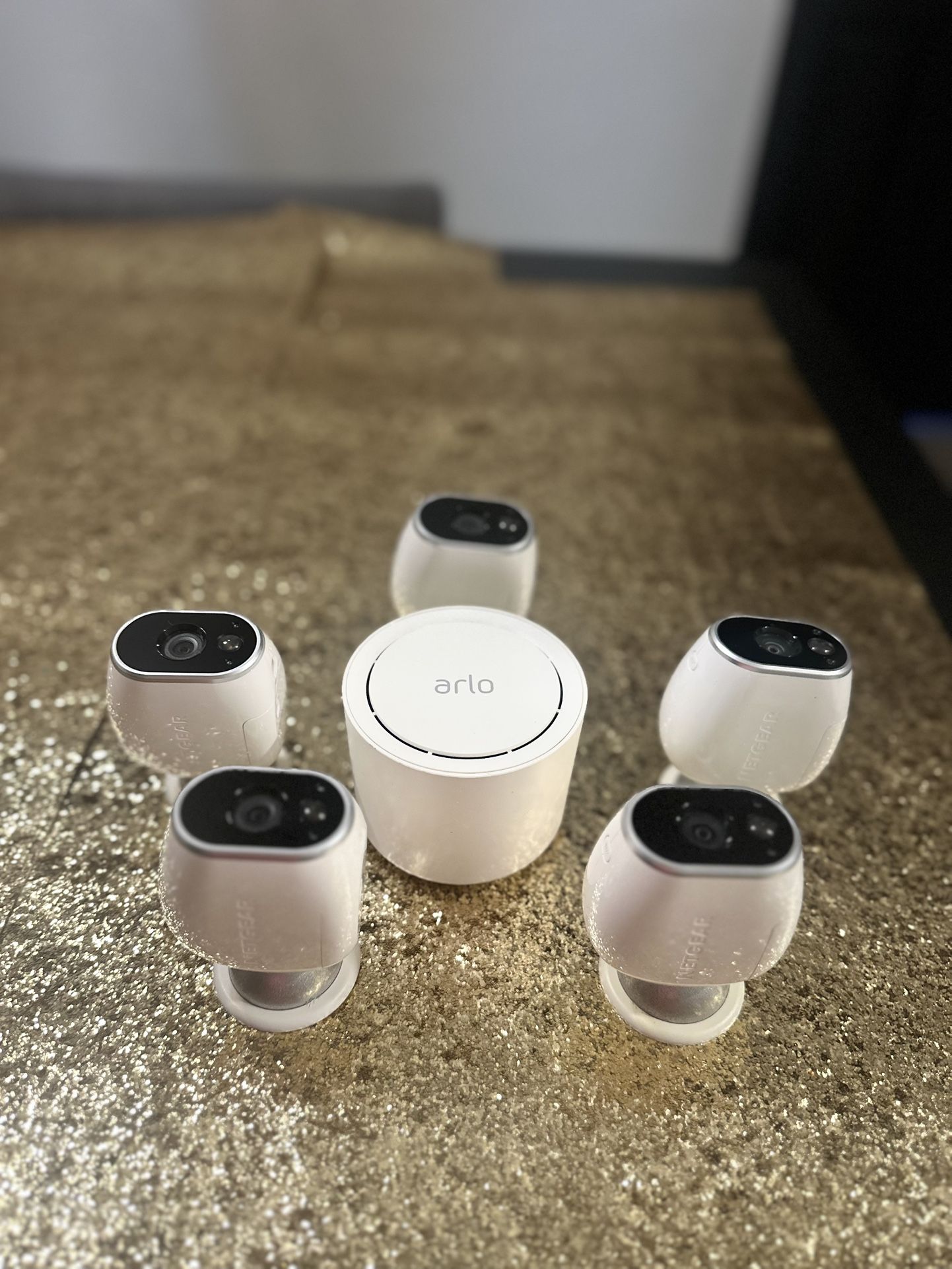 Netgear Arlo Wire-Free HD Security Cameras and magnetic mounts.
