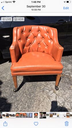 St Timothy orange tufted vinyl executive desk chair
