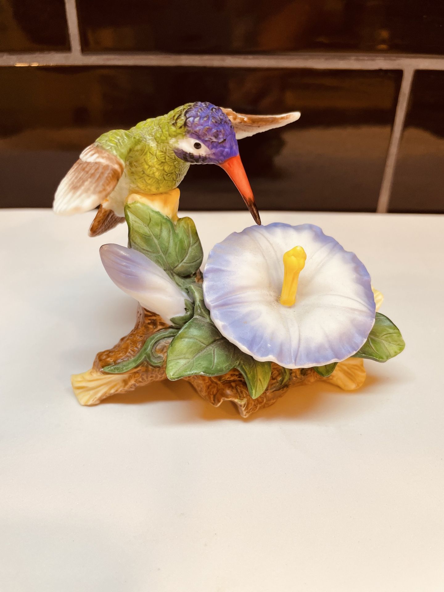 Vintage porcelain hummingbird in flight with flower figurine
