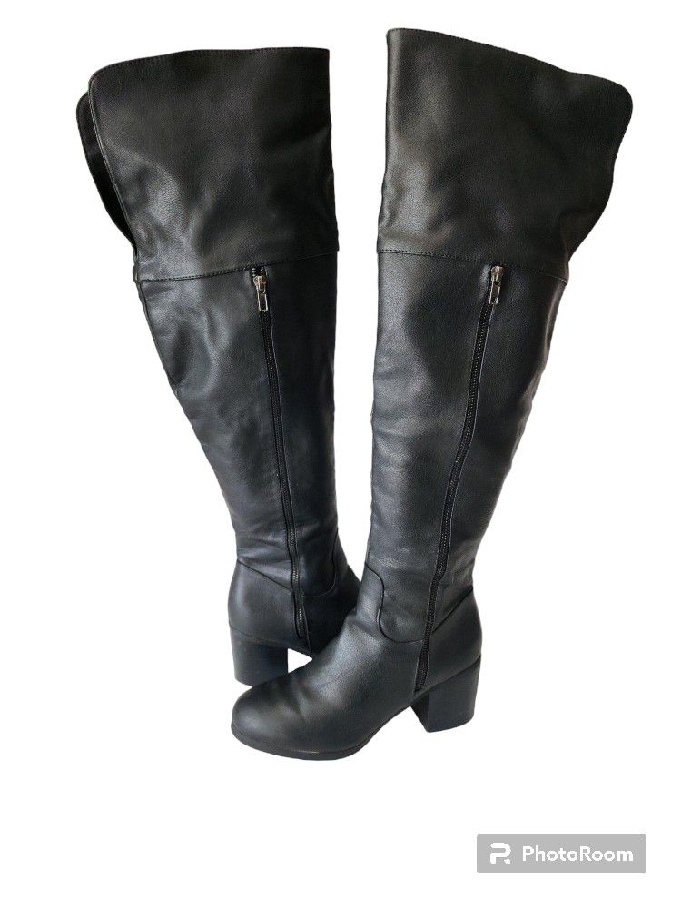 Black leather above the knee heeled boots