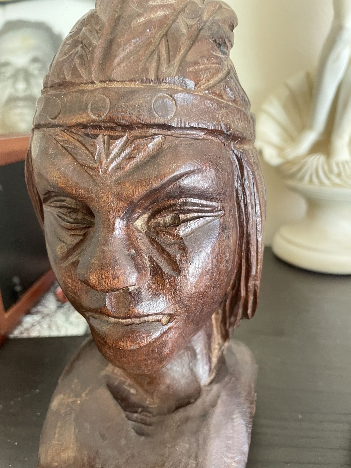 Native American statues perhaps book shelf holders