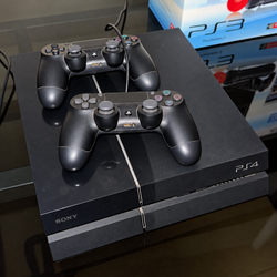 PS4 with 2 games and 2 controllers