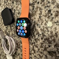 Apple Watch Series 10 GPS 42mm Black with orange band (band not apple)    1 year apple warranty