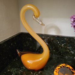 Crystal swans , orange , perfect to set two hundred dollars large , very heavy