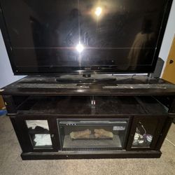Seiki Tv With Entertainment Stand With Fire Place Built In 