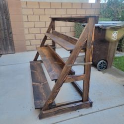 Dark stained wood plant shelf