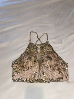 Two piece Jovani dress covered in Diamond sparkles in rhinestones crisscross back with matching detail on the skirt blush pink color original price $