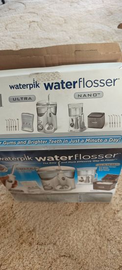 NEW ...Waterpik combo pack includes both the Waterpik Ultra Water Flosser for countertop use