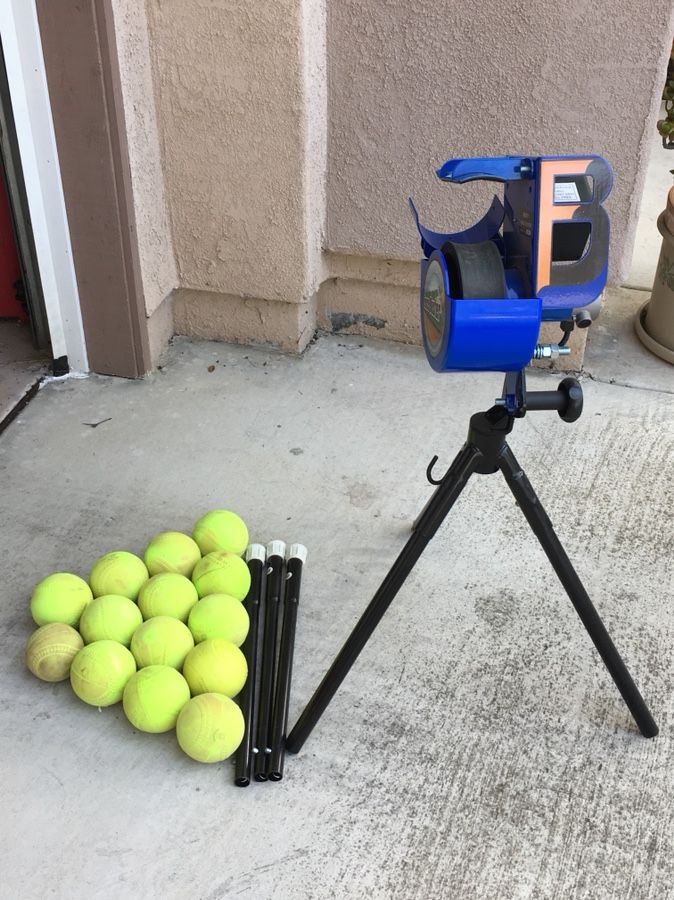 First Practice Fence Buster pitching machine for baseball and softball with Champion gas generator model 42436 in excellent used condition