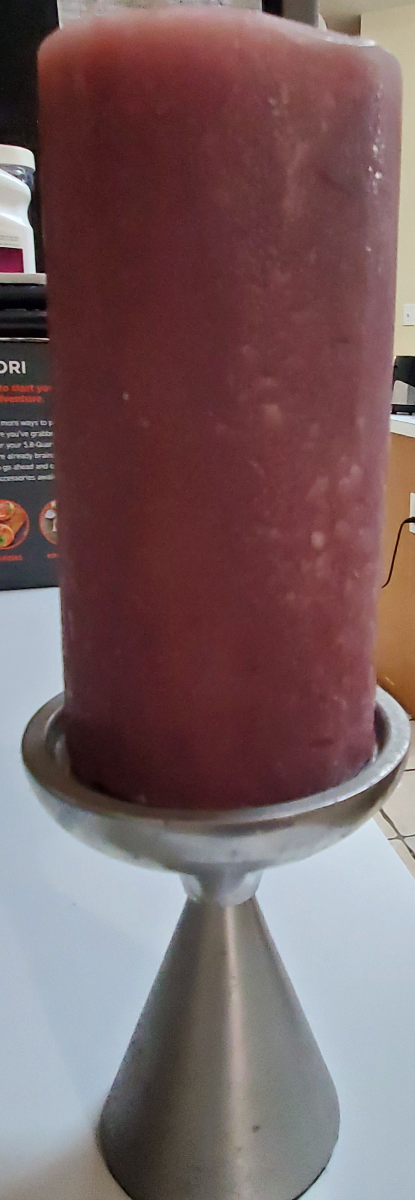 Purple pillar candle on nickel base. Never used or has been burned. Display only.