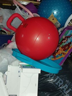 Two toy boxes that have a lot of toys inside