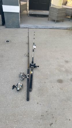 Two fishing poles, a Shakespeare sturdy stick and a DAIWA 2600 and ZEBCO808 saltwater fishing real