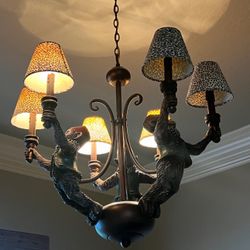 Vintage flying monkeys chandelier. 3 monkeys ,6 lights, 6 shades. In great condition!