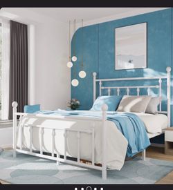 White metal queen bed with headboard and footboard