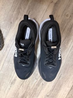 Hoka woman black tennis shoes