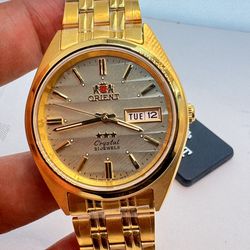 Orient Watch  Automatic Movement  Men Size  37 mm Diameter  8 inches Long  Goldtone Color  in Stainless Steel  Brand New Item