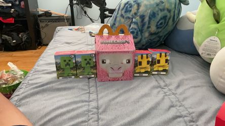 A Minecraft Movie McDonald’s toy with two Creepers and two Bees