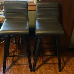 Set Of 2 gray cushioned Barstools-Like new (Full Swivel)