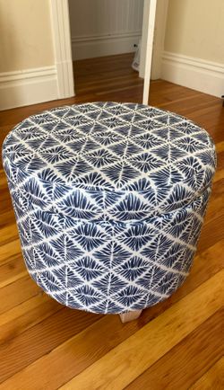 Round white and navy storage ottoman