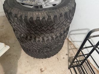 Chevy Silverado set rims All-Terrain Tires on Silver Alloy Wheels