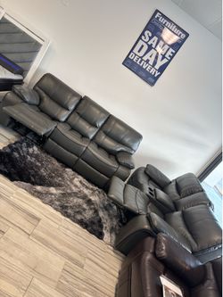 Limited time sale. Madrid, gray leather reclining sofa and loveseat set only $999. Easy finance option. Same-day delivery.