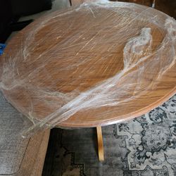 table with leaf and six chairs.