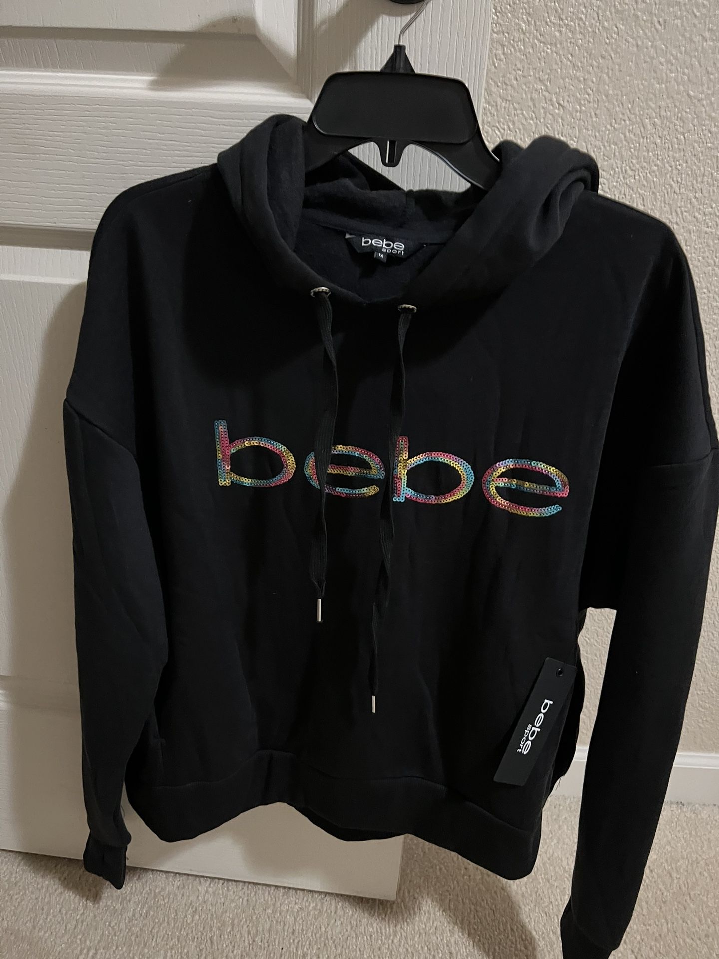  NEW. BEBE. BLACK HOODIE WITH POCKETS. Size 1x