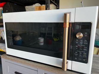 GE Cafe CVM517P4M6W2t — a 1.7 cu. ft. convection over-the-range microwave