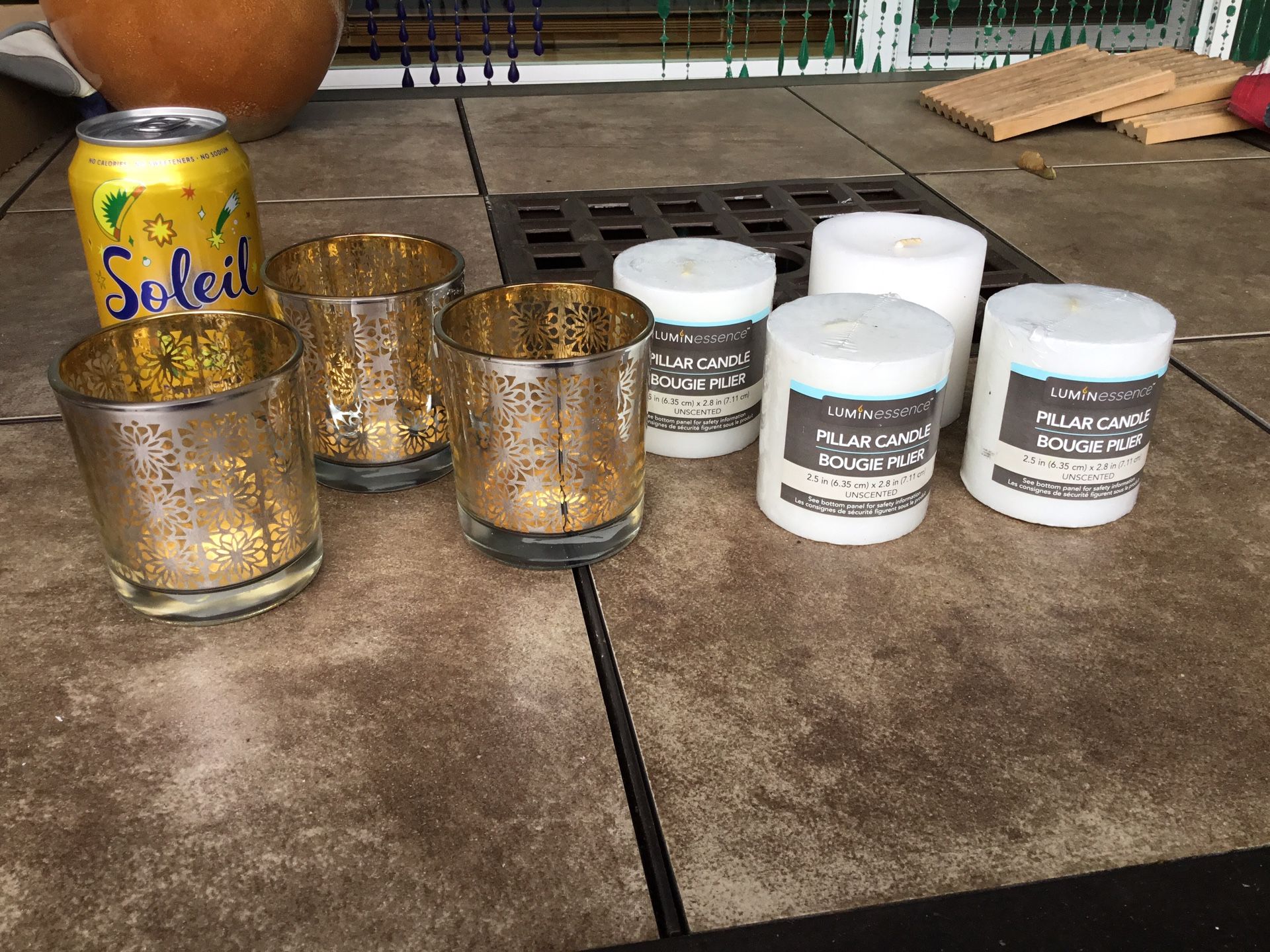 Three- Crate & Barrel Votive Candle Holders 3-1/4”H X 3”D And Four New Pillar Candles 2.5” X 2.8”. Unwrapped Candle Slightly Larger