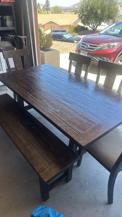 Dining table, bench and four chairs