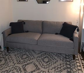Gray mid century modern style couch