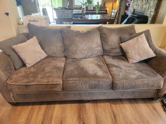 Comfortable used sofa and loveseat. Olive green.  Non smoking home.