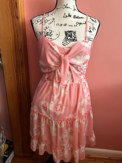 Woman’s pink floral mid length dress size medium