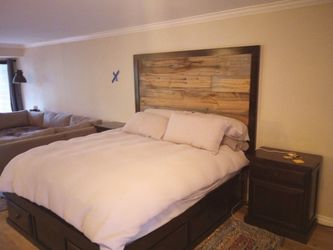 Bed frame with mattress and night stand