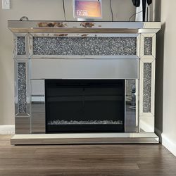 electric fireplace, glass table and lamps