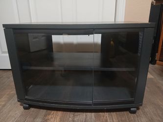 TV stand with durable finish tempered glass doors consistent with models like bush vs64939
