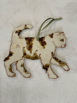 Hand-painted porcelain calico cat Christmas ornament by Norman Pottery