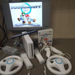 Nintendo Wii With 2 Remotes/Nunchucks And Wheels With Mario Kart
