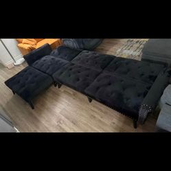 Black velvet buttoned sofa in very good condition, can be converted into a complete futon-style bed