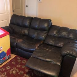 Two big leather couches recliner at both ends 
